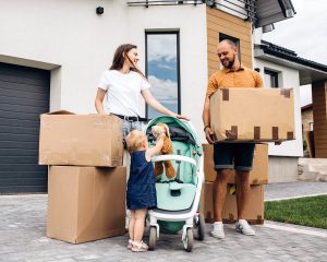 A young family ready to move in to their new home.