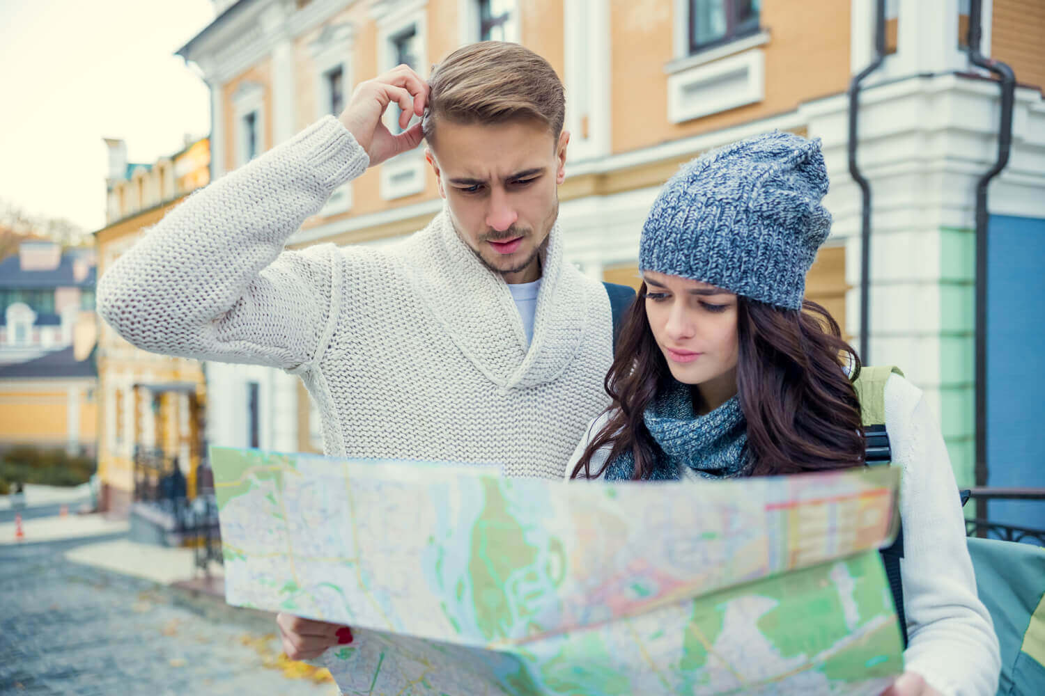 A couple looking at a map to understand UK debt habits.