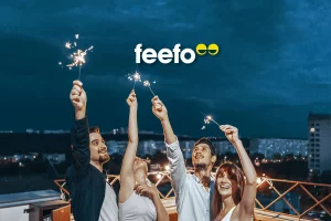 A group of people celebrating Feefo.