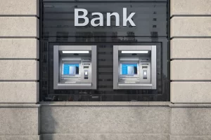 A bank with two ATMs outside.